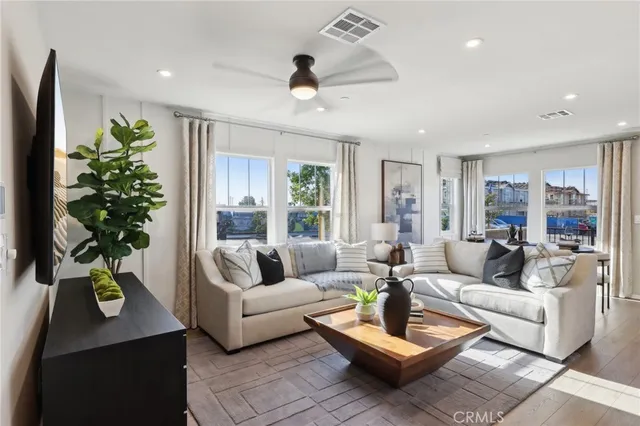 a living room with furniture and a large window
