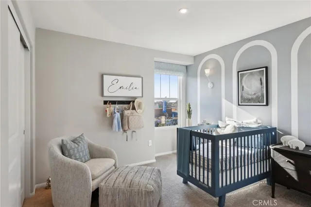 a bedroom with furniture and window