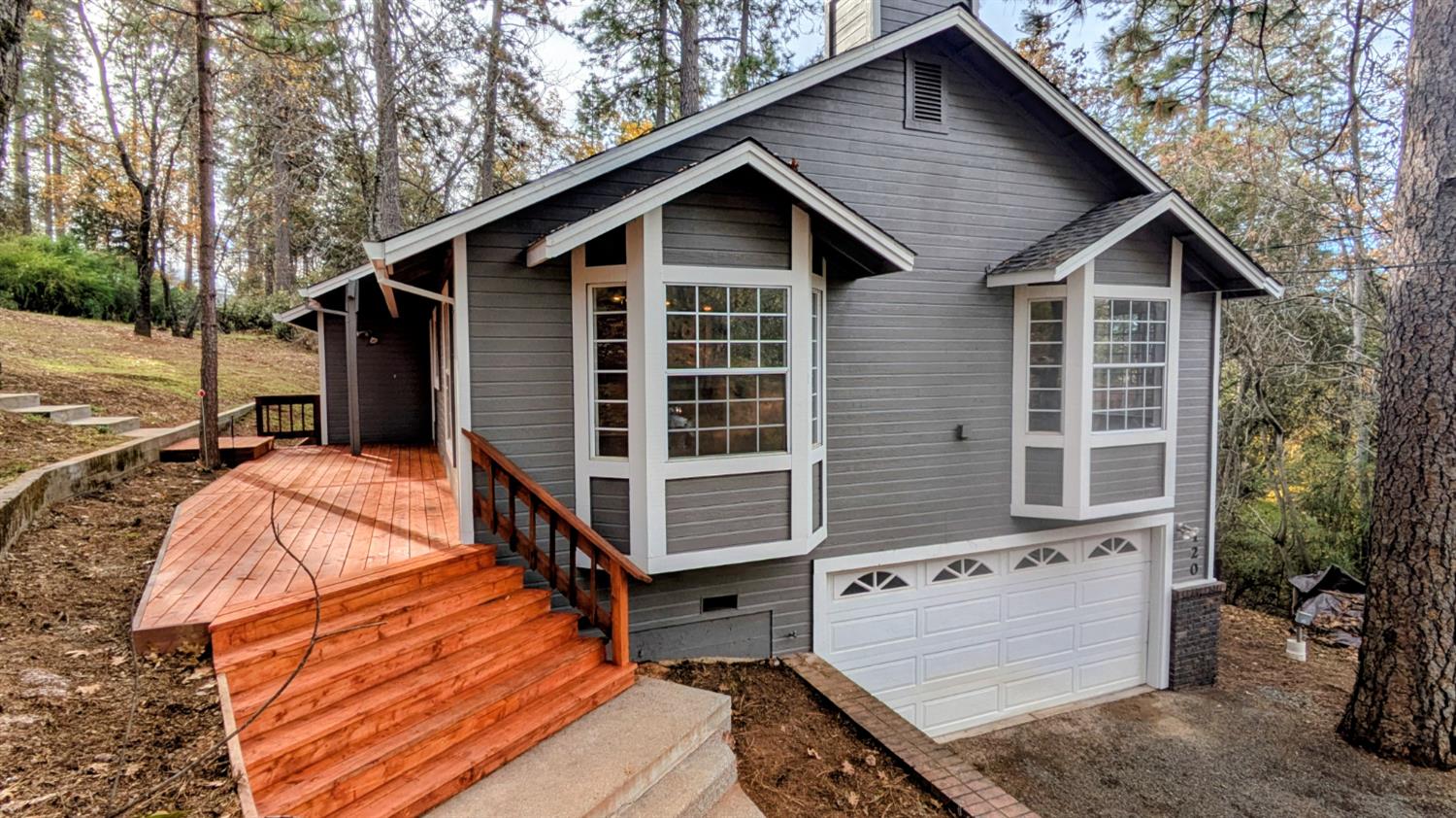 a view of house with backyard