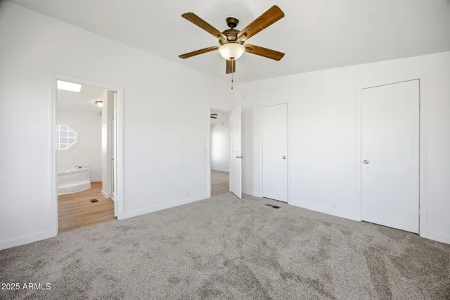 a bathroom with a double vanity sink mirror and