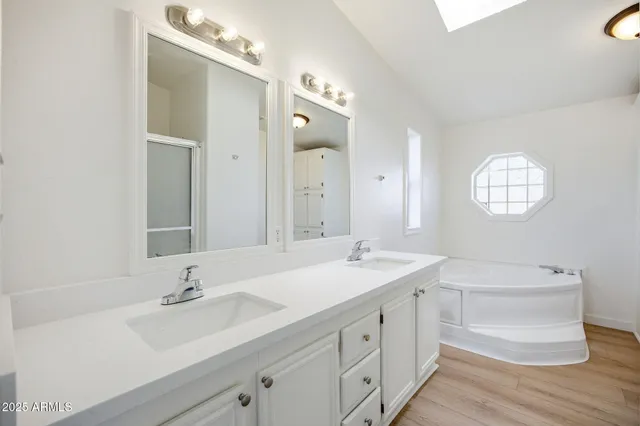 a bathroom with a shower and a mirror
