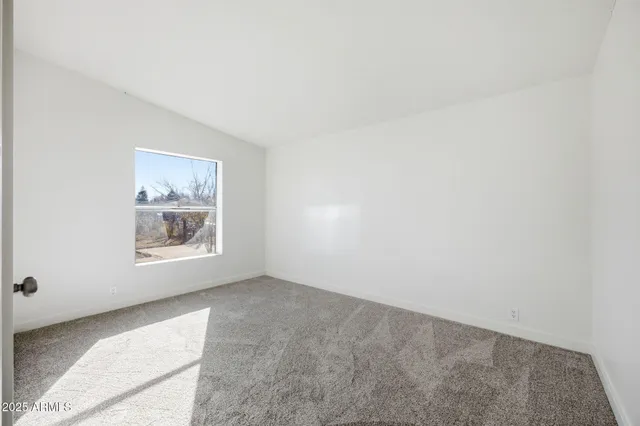 a view of hallway with livingroom