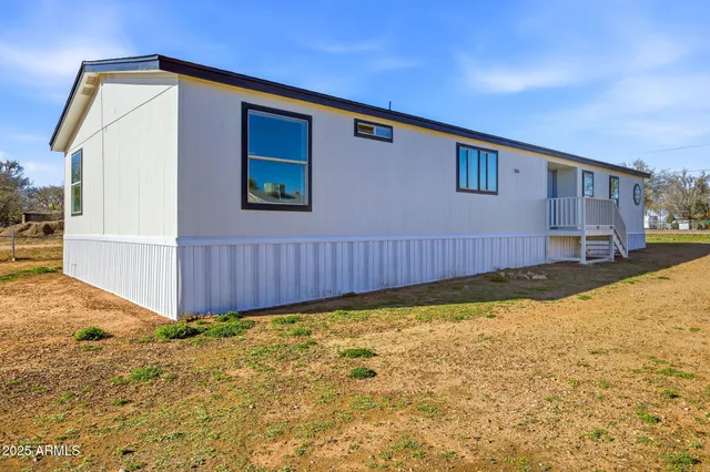 a view of a backyard of the house