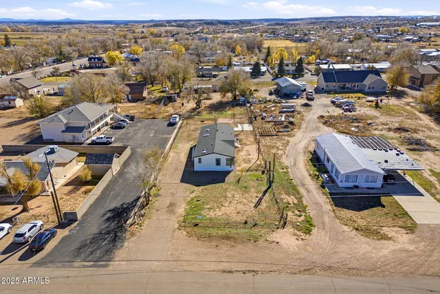 an aerial view of a house with a swimming pool