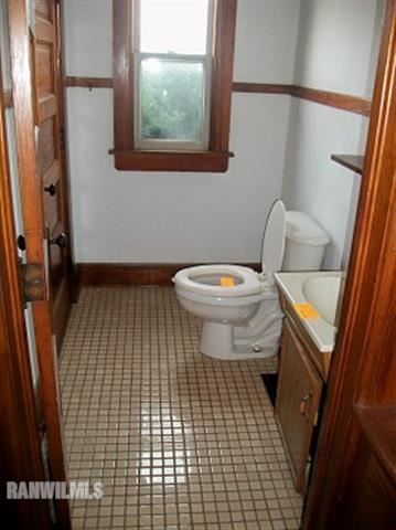 102 Washington Street Ridott, IL 61067 - Photo 5 of 11 a bathroom with a toilet and a shower