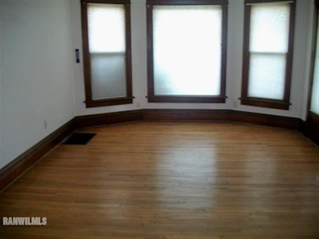 102 Washington Street Ridott, IL 61067 - Photo 6 of 11 a view of a room with wooden floor and windows