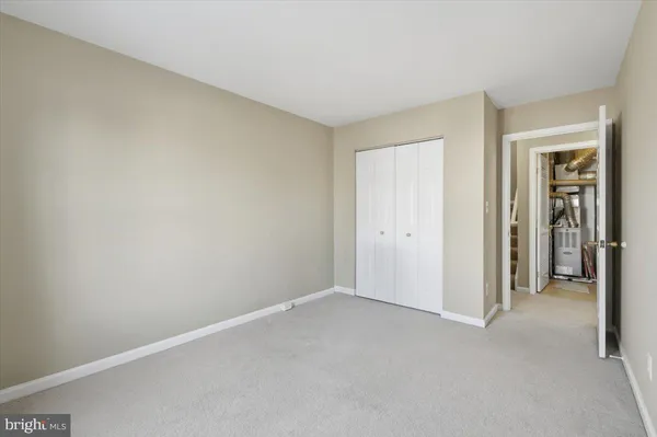 a view of an empty room and closet