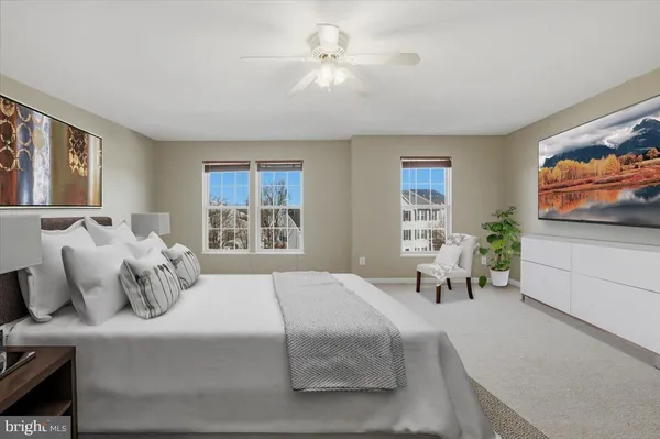 a bedroom with a bed and a couch