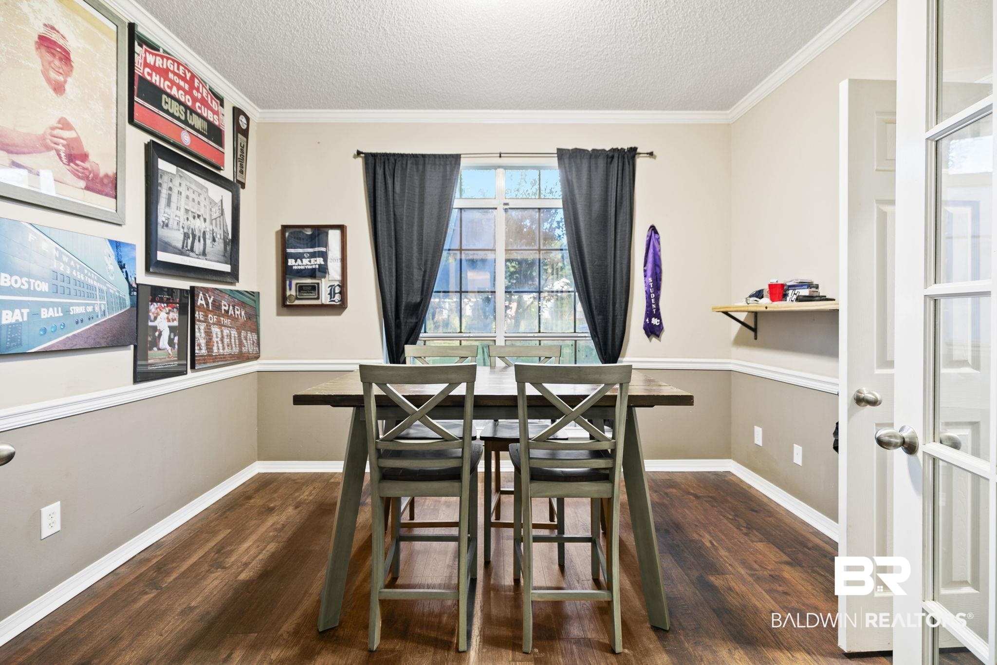 10550 Patrick Avenue Grand Bay, AL 36541 - Photo 13 of 43 Dining room featuring dark hardwood / wood-style floors, ornamental molding, and a textured ceiling
