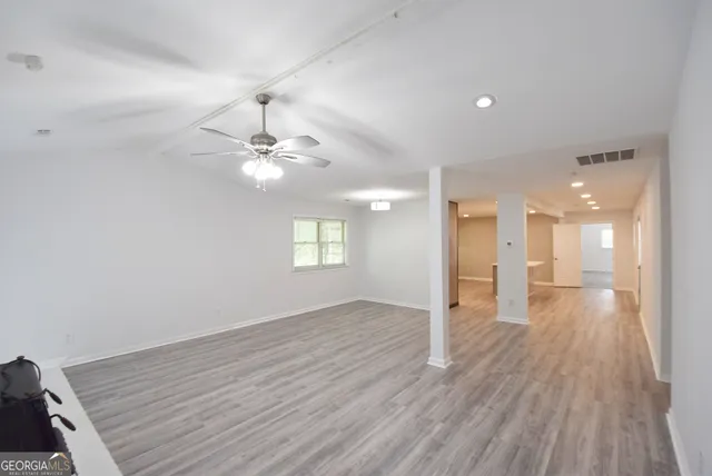 wooden floor fireplace and windows in a room