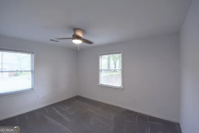 a view of a bathroom from the hallway