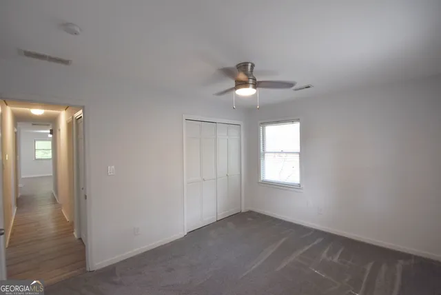 a bathroom with a shower and a glass door