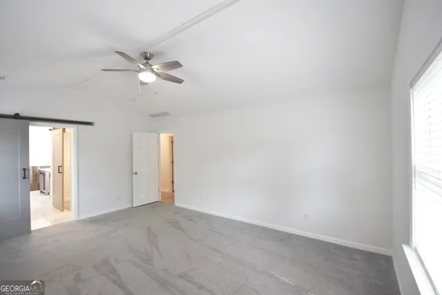 a bathroom with a bathtub sink and mirror
