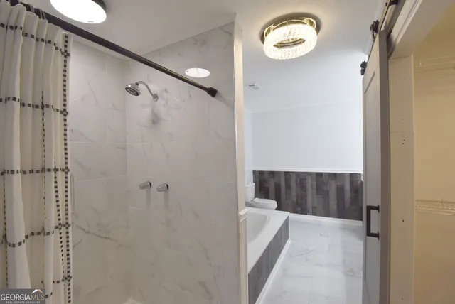 a view of a patio with table and chairs and wooden floor