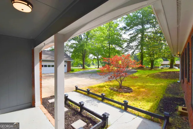 a large kitchen with a refrigerator a kitchen island a stove and a sink