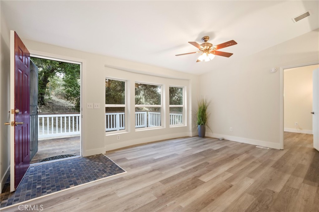 3550 Ardana Road Paso Robles, CA 93446 - Photo 11 of 23 a view of an empty room with a window and a kitchen