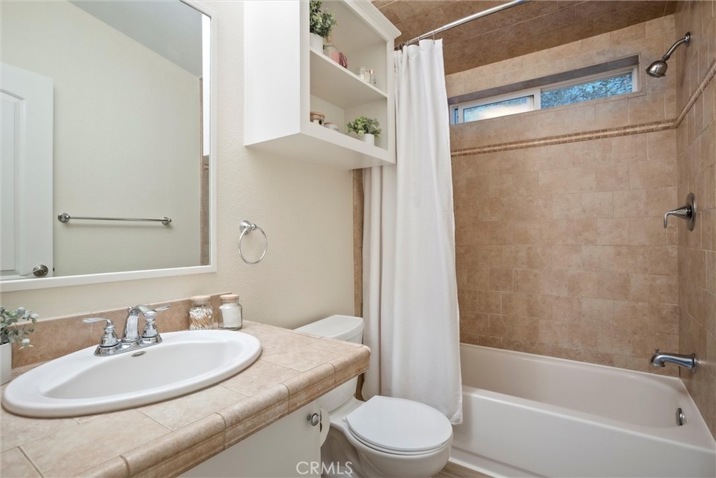 3550 Ardana Road Paso Robles, CA 93446 - Photo 22 of 23 a bathroom with a granite countertop sink toilet and shower