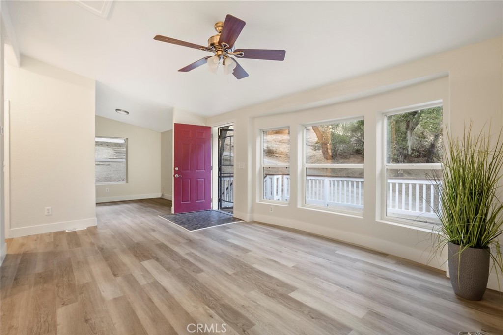 3550 Ardana Road Paso Robles, CA 93446 - Photo 10 of 23 a view of an empty room with a window and wooden floor