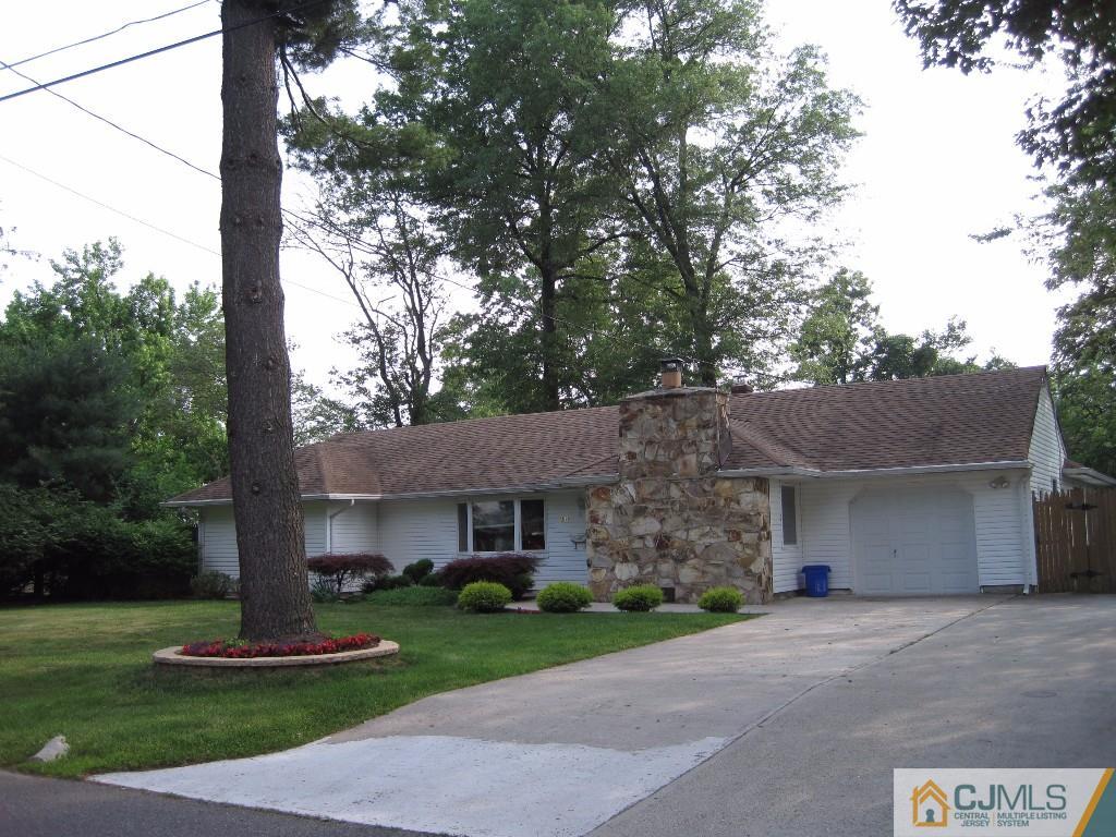 26 Richard Road Edison, NJ 08820 - Photo 1 of 18 a front view of a house with a yard