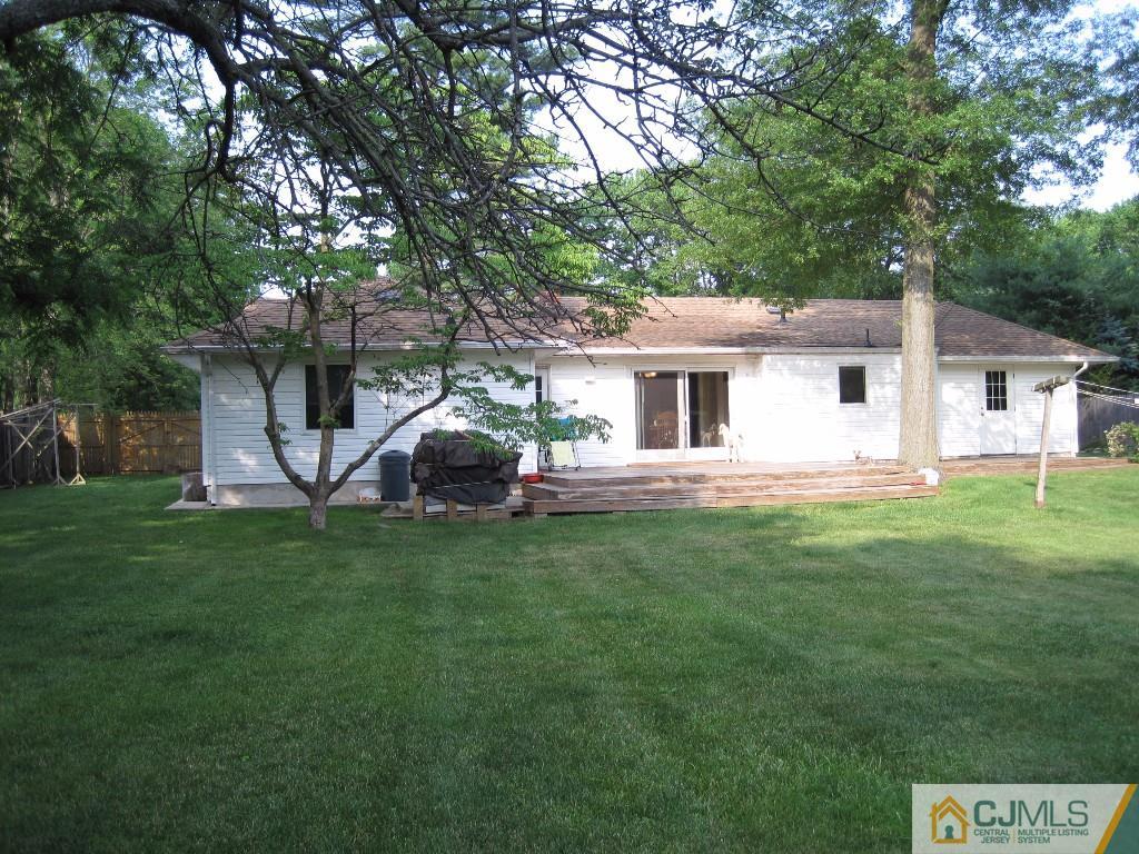 26 Richard Road Edison, NJ 08820 - Photo 17 of 18 a view of a house with a backyard