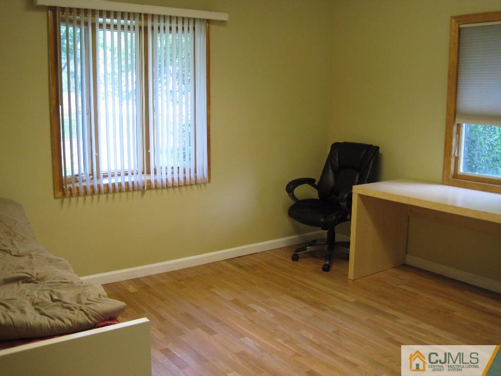 26 Richard Road Edison, NJ 08820 - Photo 7 of 18 a room with furniture and a window