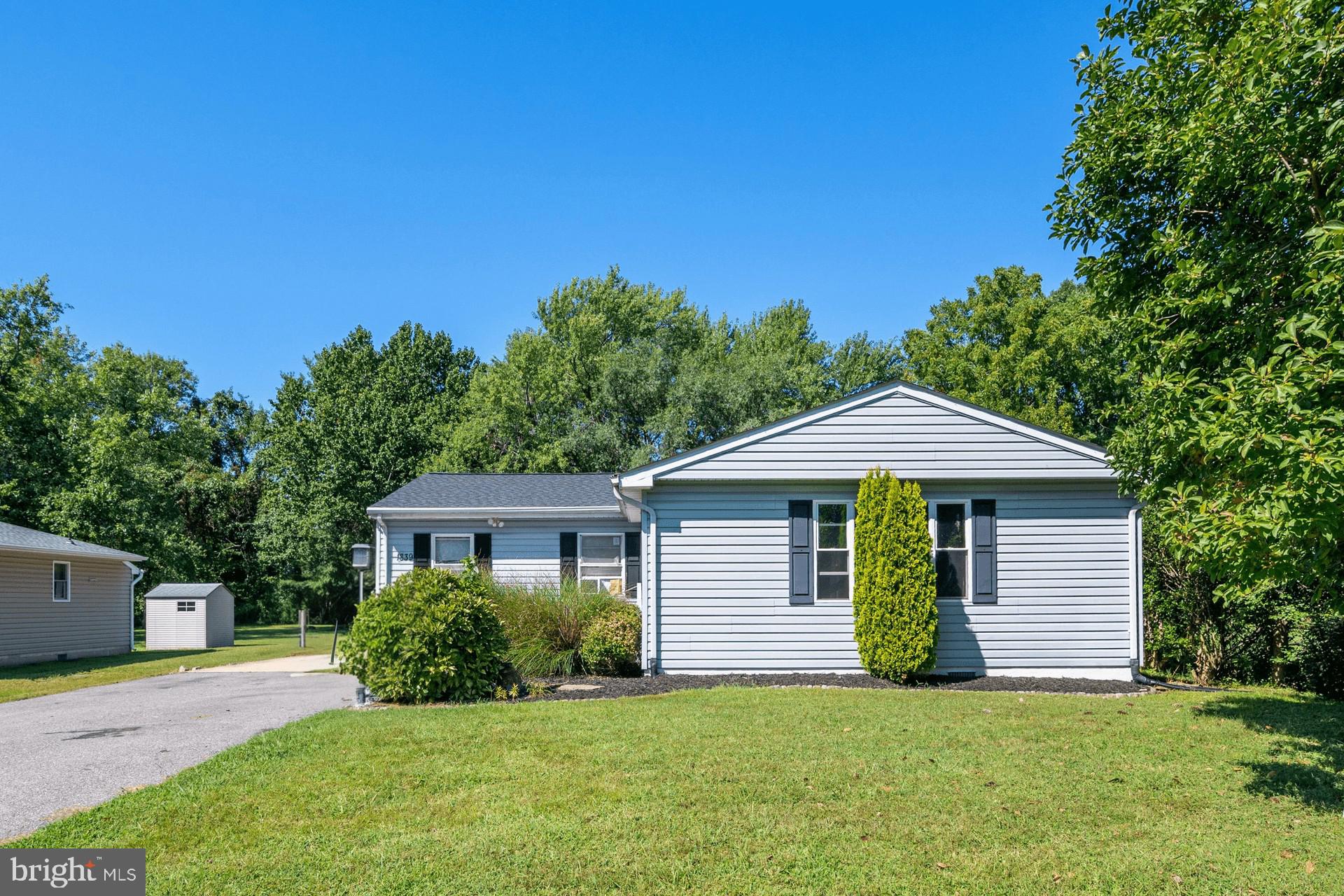 1839 Harbor Drive Chester, MD 21619 - Photo 2 of 23 a front view of a house with a garden