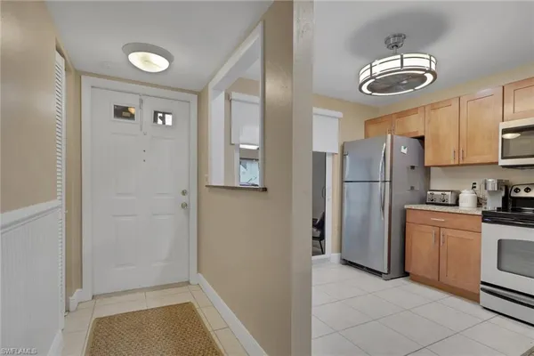 a kitchen with a sink a stove and refrigerator