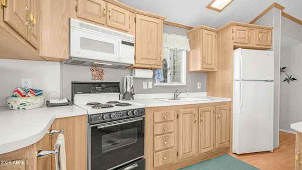a en suite bathroom with a sink and a mirror