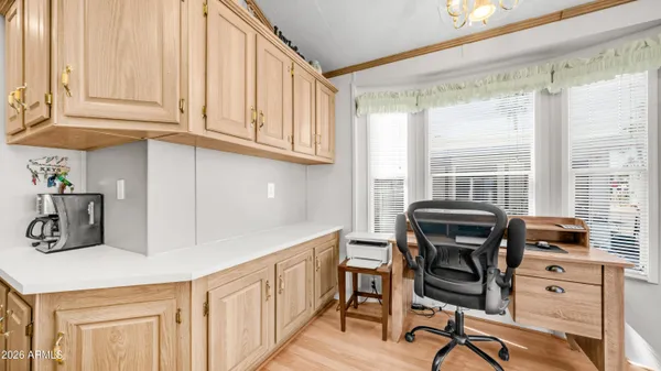 a bathroom with a toilet a sink and a window