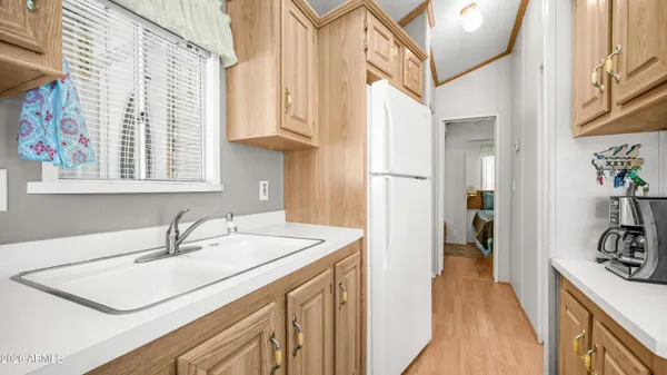 a bathroom with a sink and a mirror with a toilet