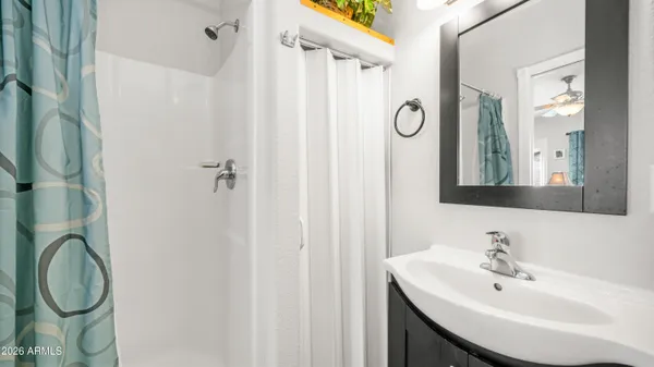 a view of a patio with table and chairs