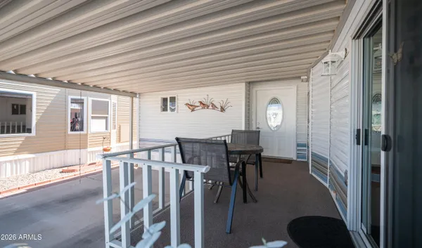a kitchen with furniture a window and appliances