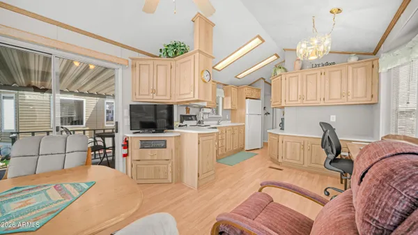 a kitchen with a sink appliances cabinets and furniture