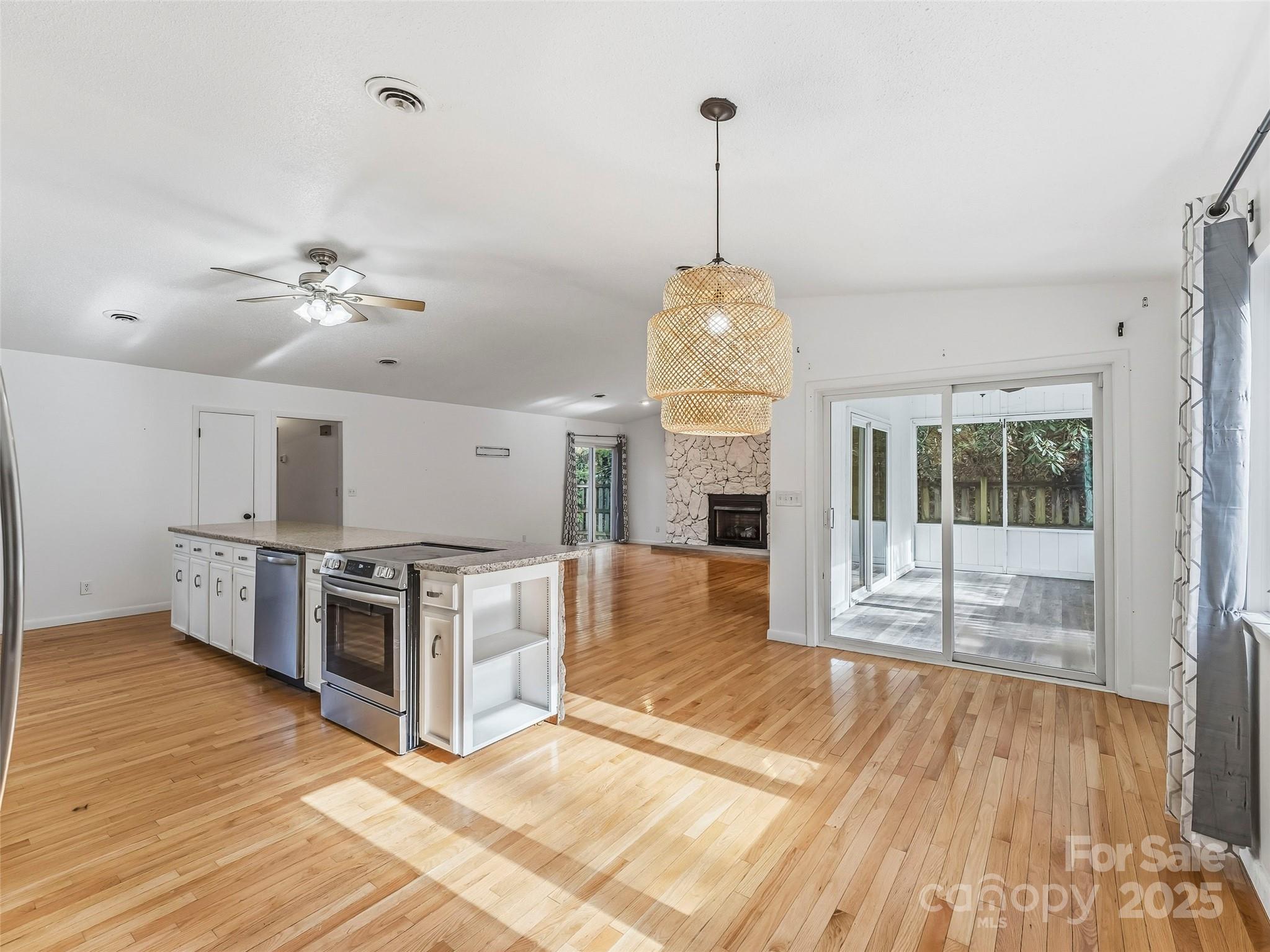 27 Spring Valley Road Pisgah Forest, NC 28768 - Photo 2 of 37 a view of a kitchen with a sink cabinets and wooden floor