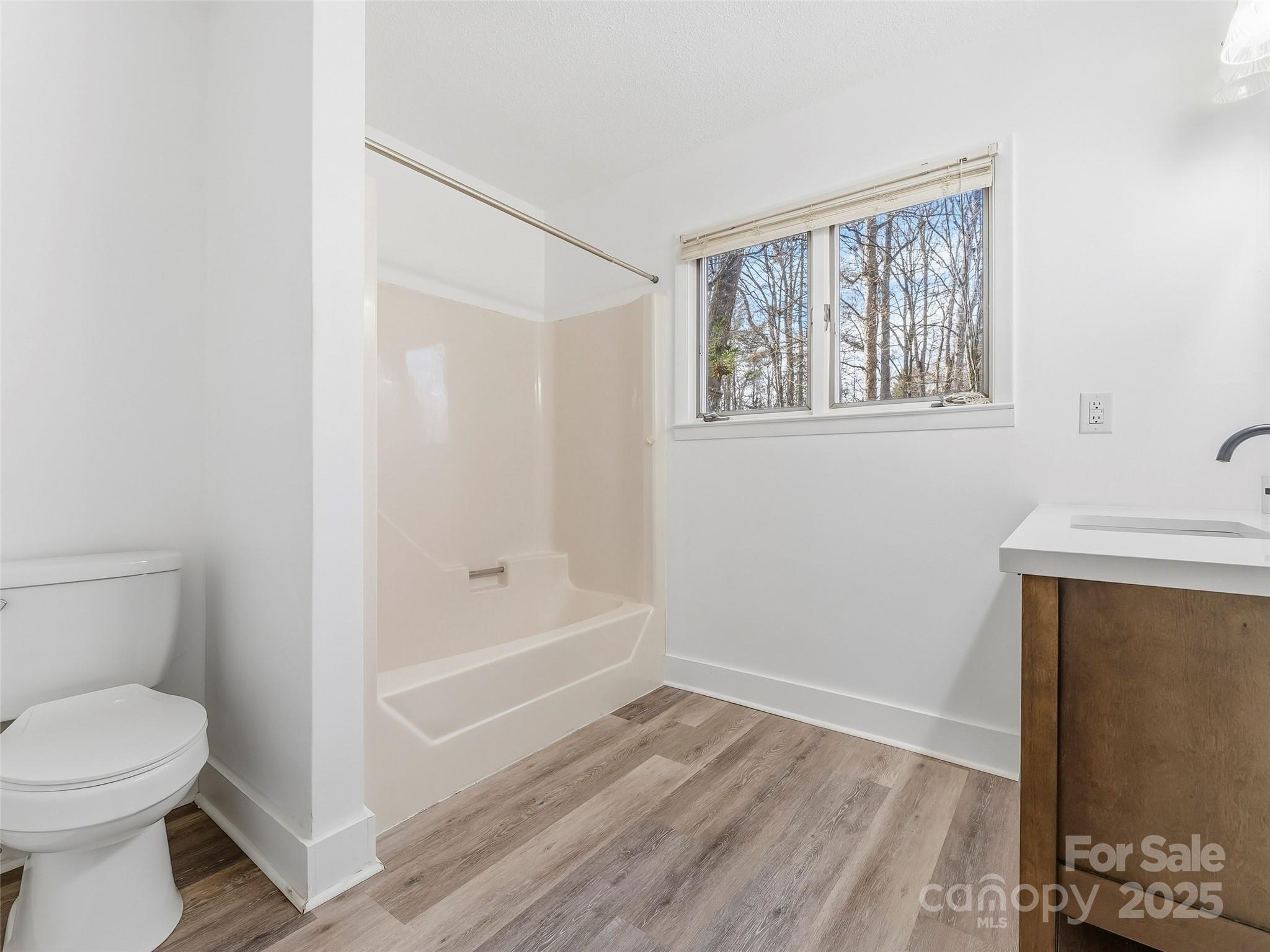 27 Spring Valley Road Pisgah Forest, NC 28768 - Photo 24 of 37 a bathroom with a toilet and a shower