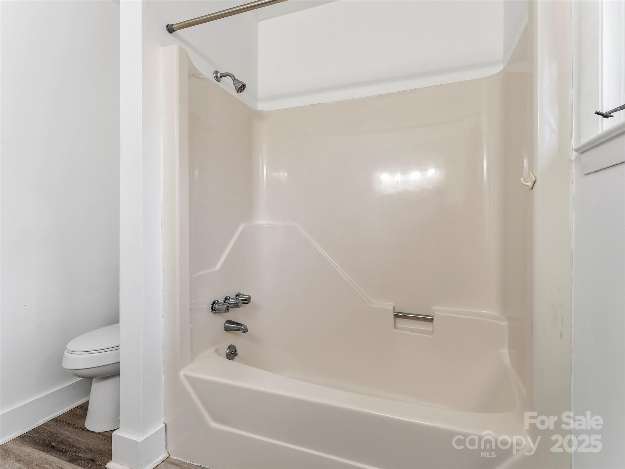 27 Spring Valley Road Pisgah Forest, NC 28768 - Photo 26 of 37 a bathroom with a bathtub and a toilet
