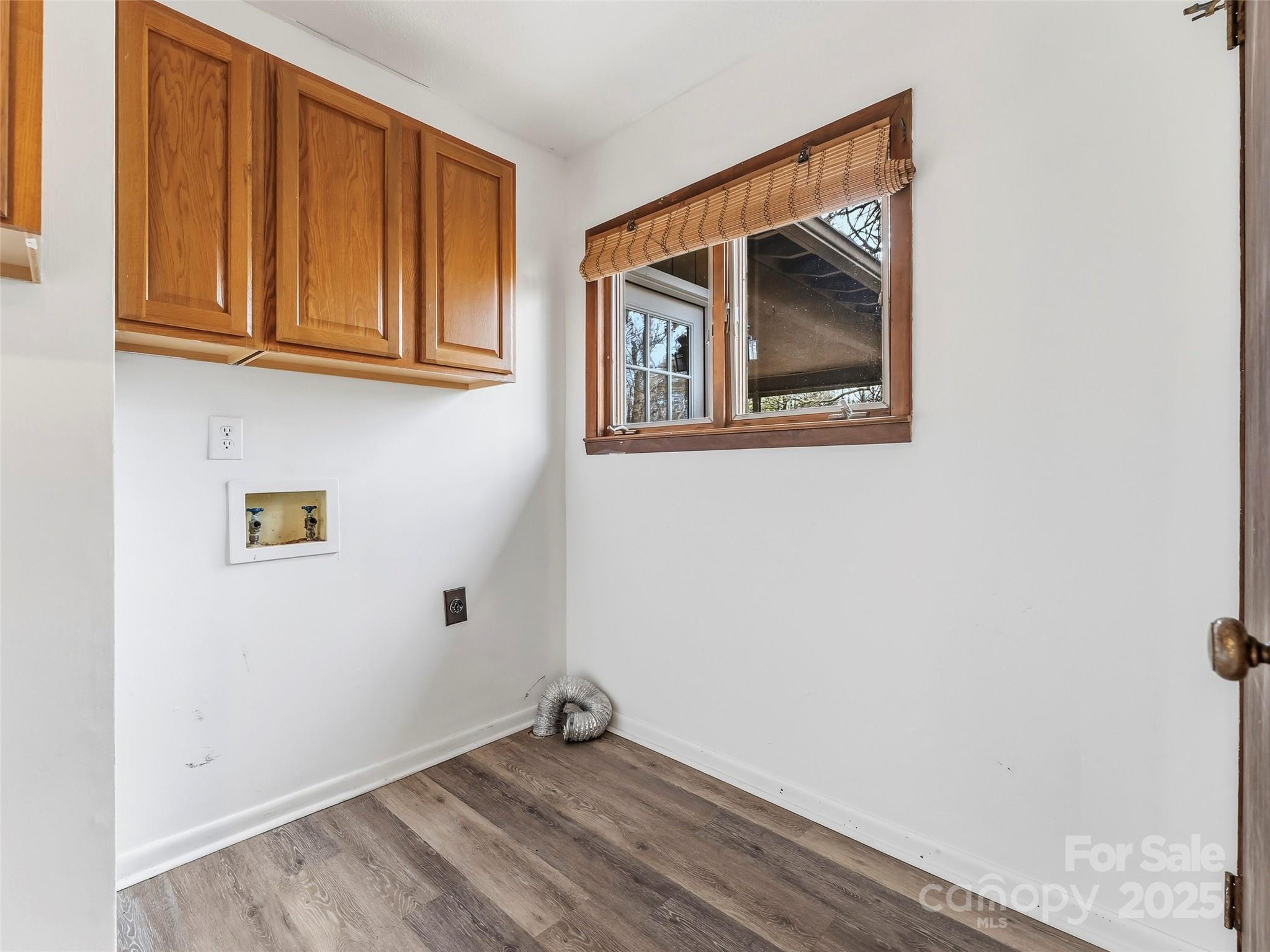 27 Spring Valley Road Pisgah Forest, NC 28768 - Photo 27 of 37 a view of an empty room with wooden floor and a window