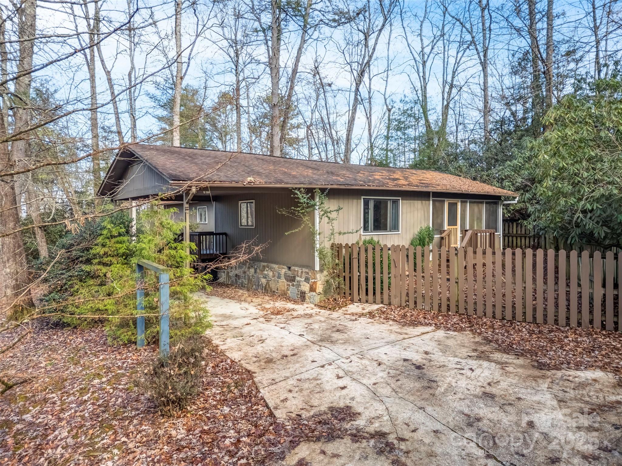27 Spring Valley Road Pisgah Forest, NC 28768 - Photo 29 of 37 a house with trees in the background