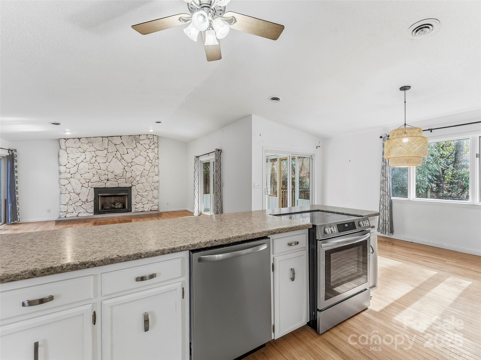 27 Spring Valley Road Pisgah Forest, NC 28768 - Photo 8 of 37 a kitchen with stainless steel appliances granite countertop a stove and a sink