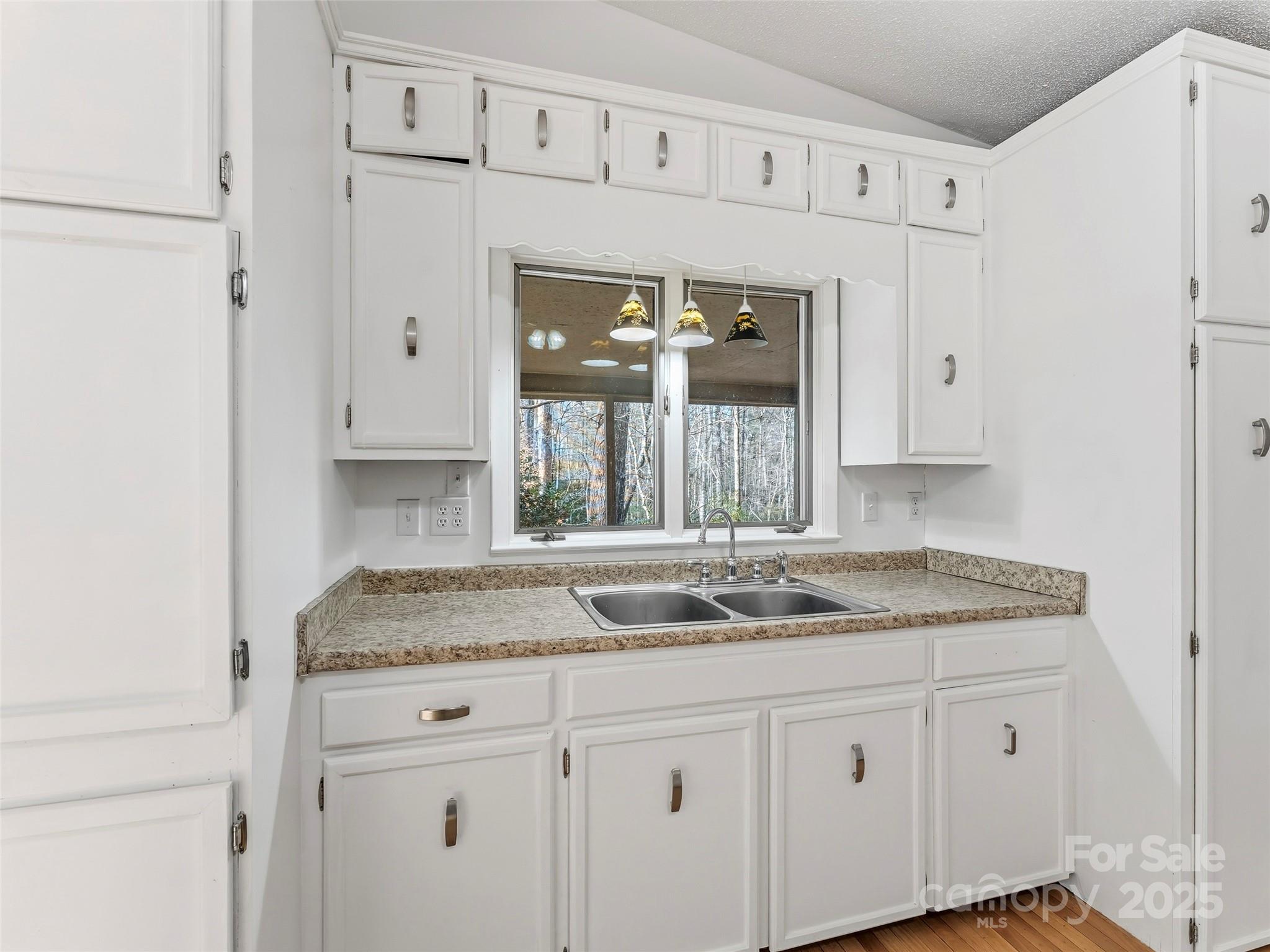 27 Spring Valley Road Pisgah Forest, NC 28768 - Photo 10 of 37 a bathroom with a granite countertop sink and a mirror