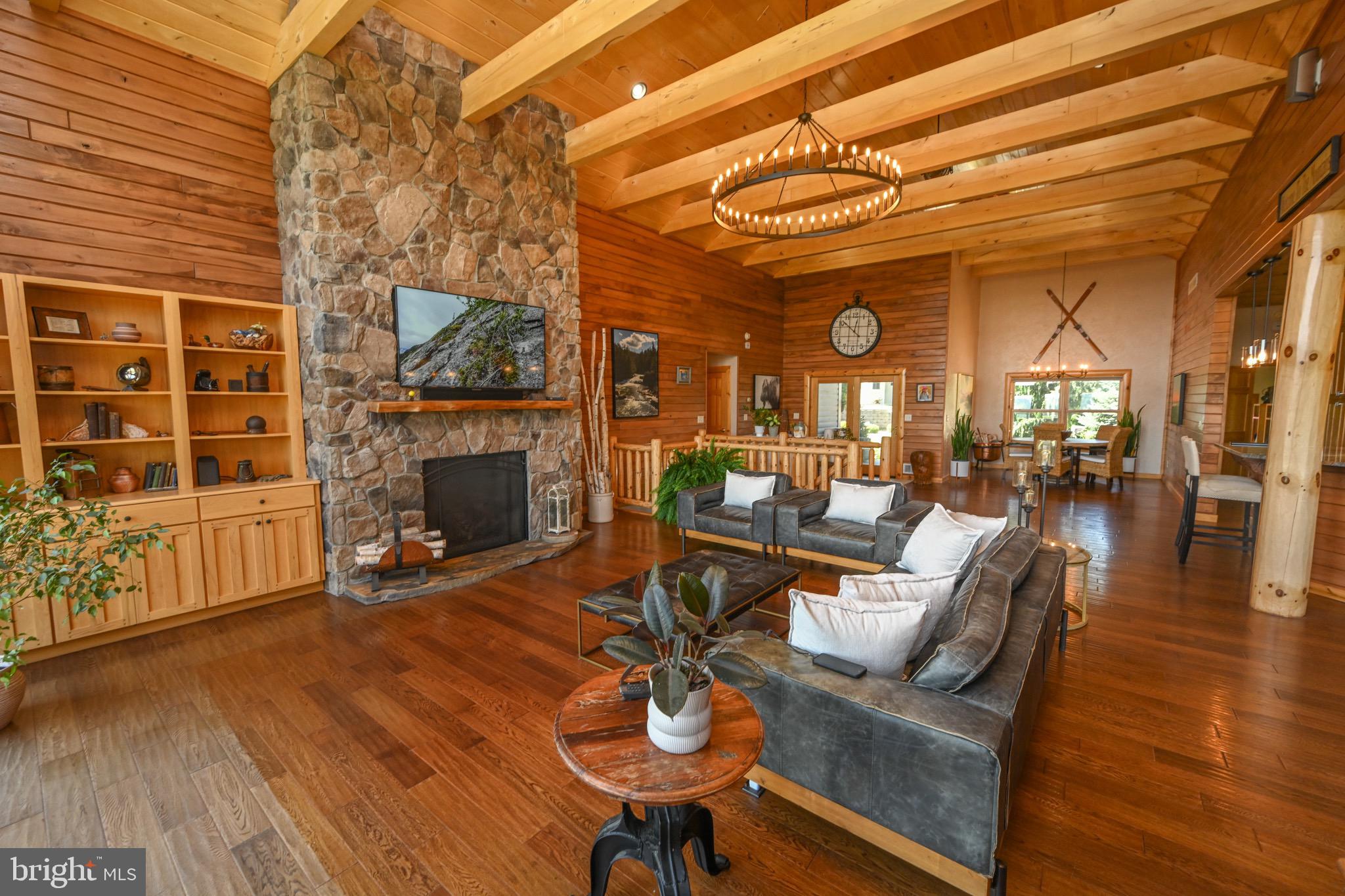 2325 Accident Friendsville Road Accident, MD 21520 - Photo 16 of 107 a living room with furniture a window and a fireplace