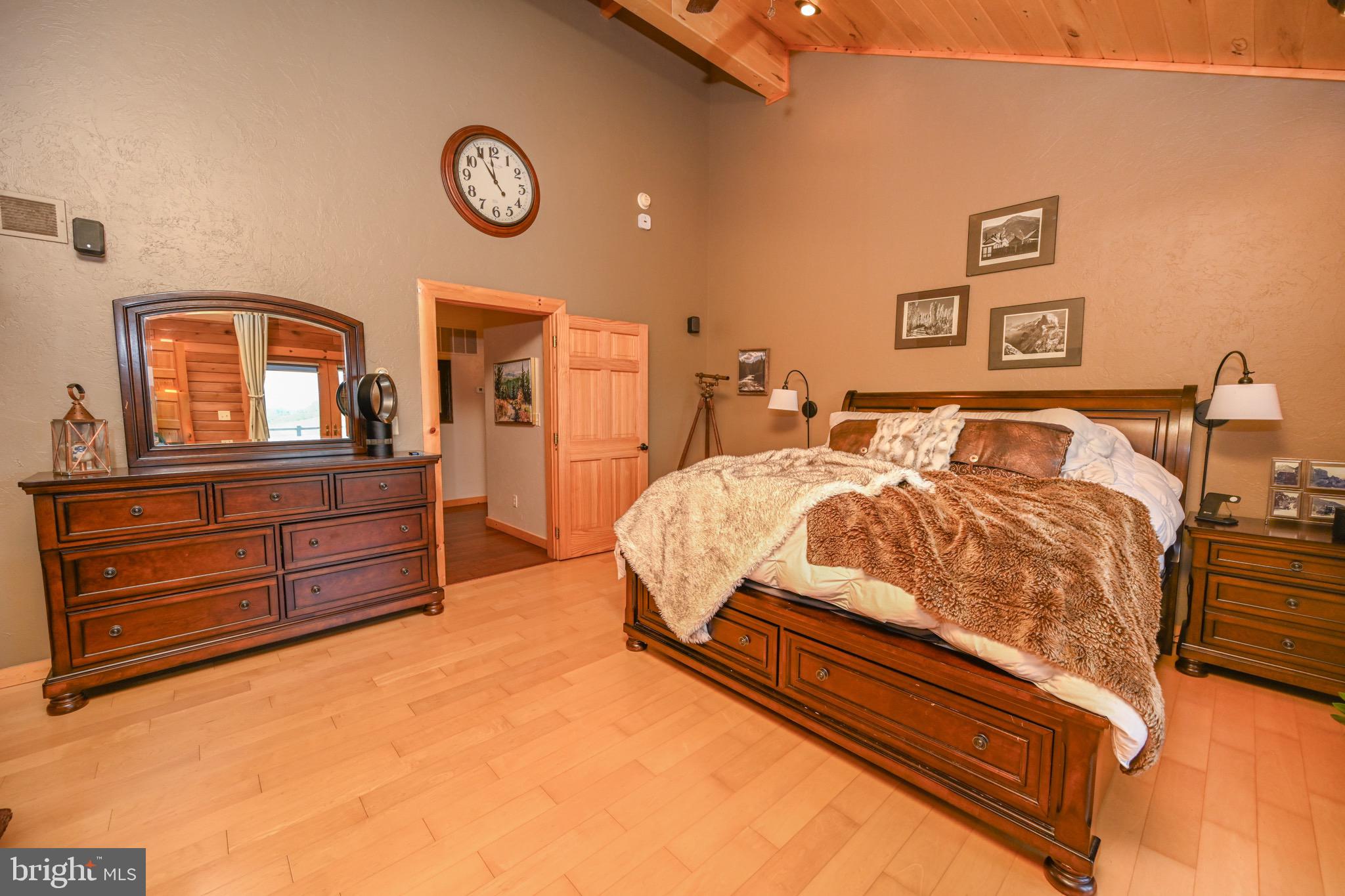 2325 Accident Friendsville Road Accident, MD 21520 - Photo 23 of 107 a bed room with a bed and a dresser