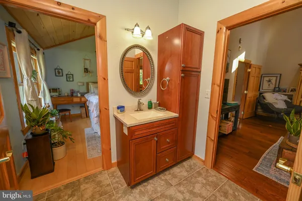 a view of a livingroom with furniture window and wooden floor