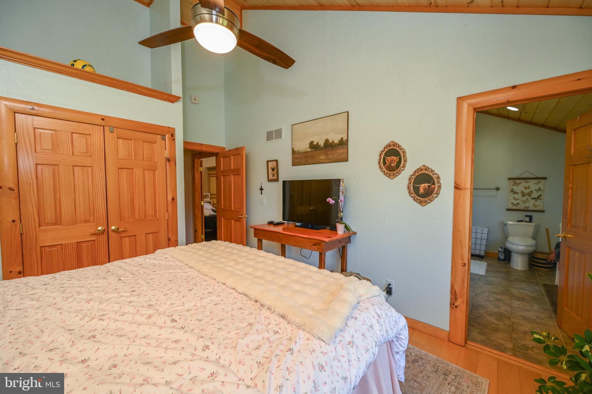 2325 Accident Friendsville Road Accident, MD 21520 - Photo 35 of 107 a bedroom with a bed and a flat screen tv