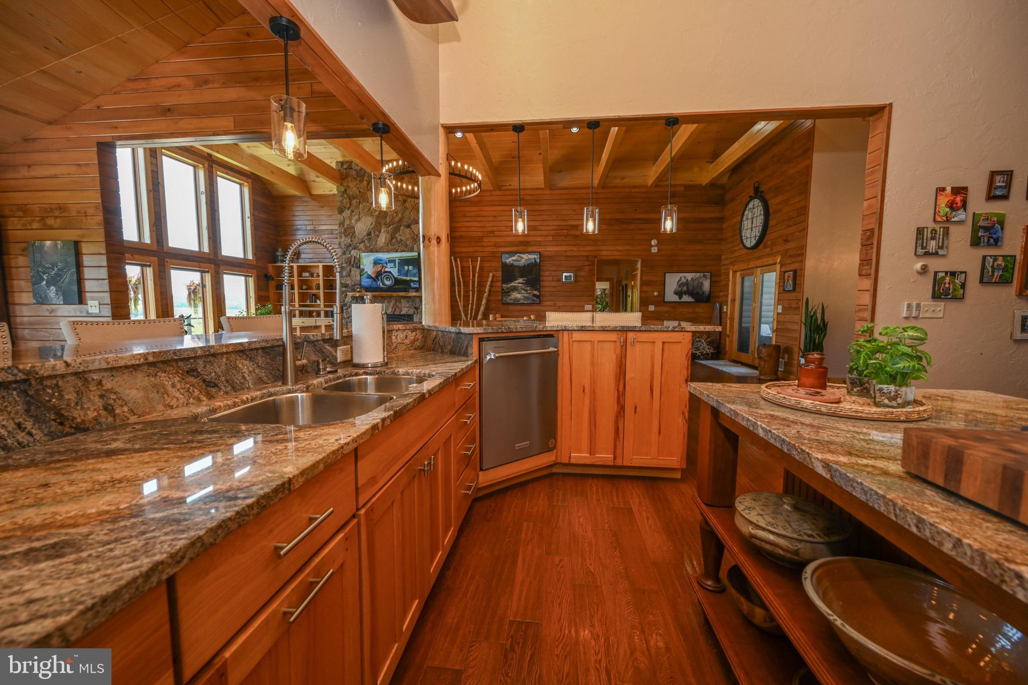 2325 Accident Friendsville Road Accident, MD 21520 - Photo 41 of 107 a kitchen with stainless steel appliances granite countertop a lot of counter space and wooden floors