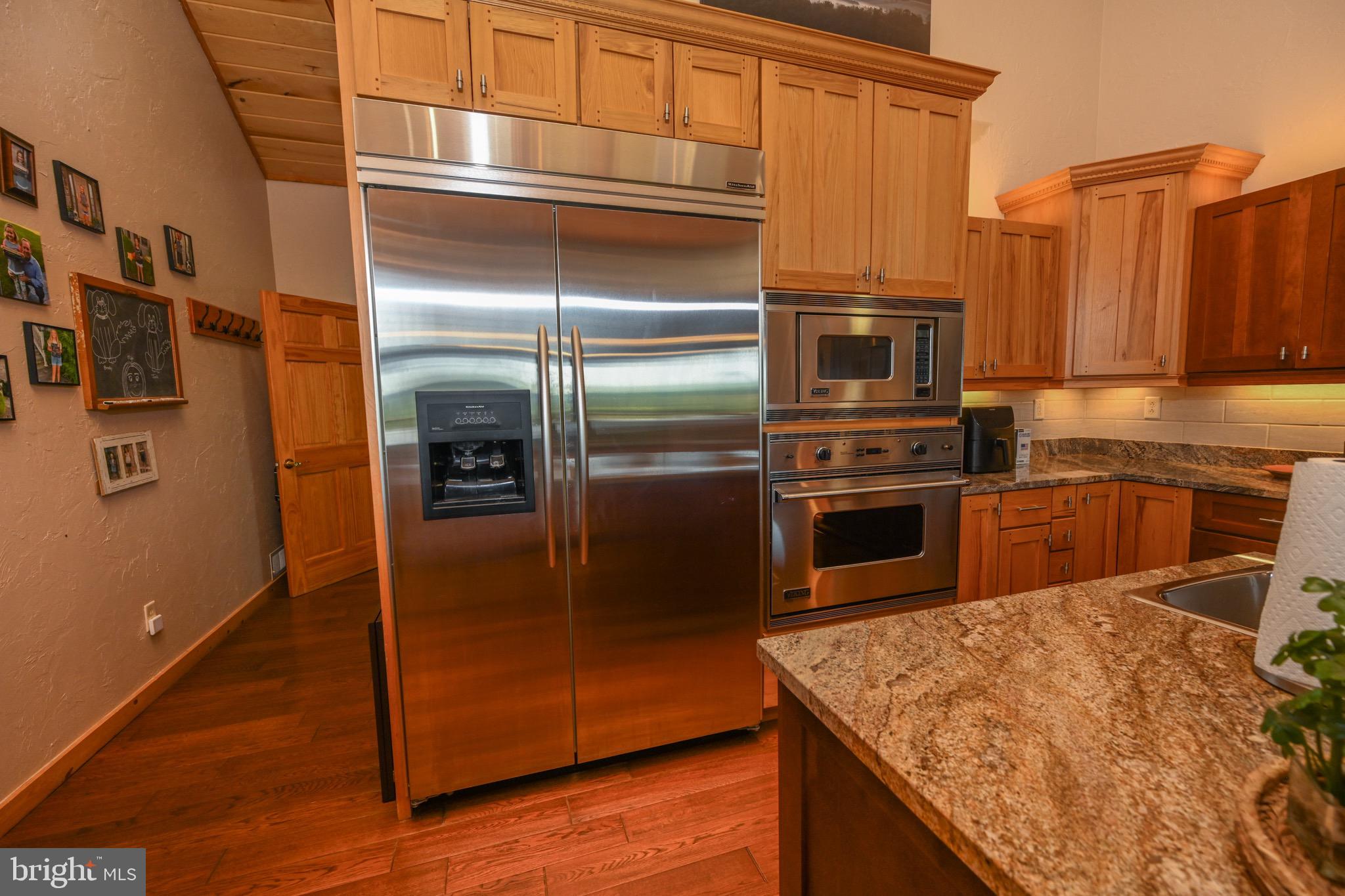 2325 Accident Friendsville Road Accident, MD 21520 - Photo 43 of 107 a kitchen with kitchen island a counter top space cabinets and stainless steel appliances