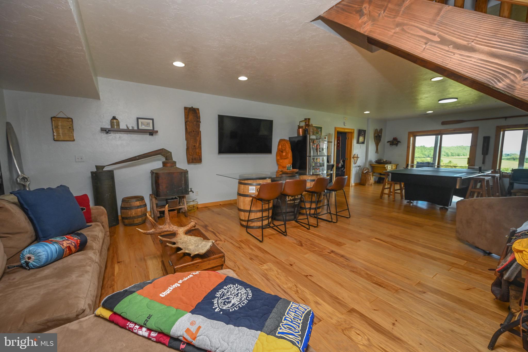 2325 Accident Friendsville Road Accident, MD 21520 - Photo 57 of 107 a living room with furniture and a flat screen tv