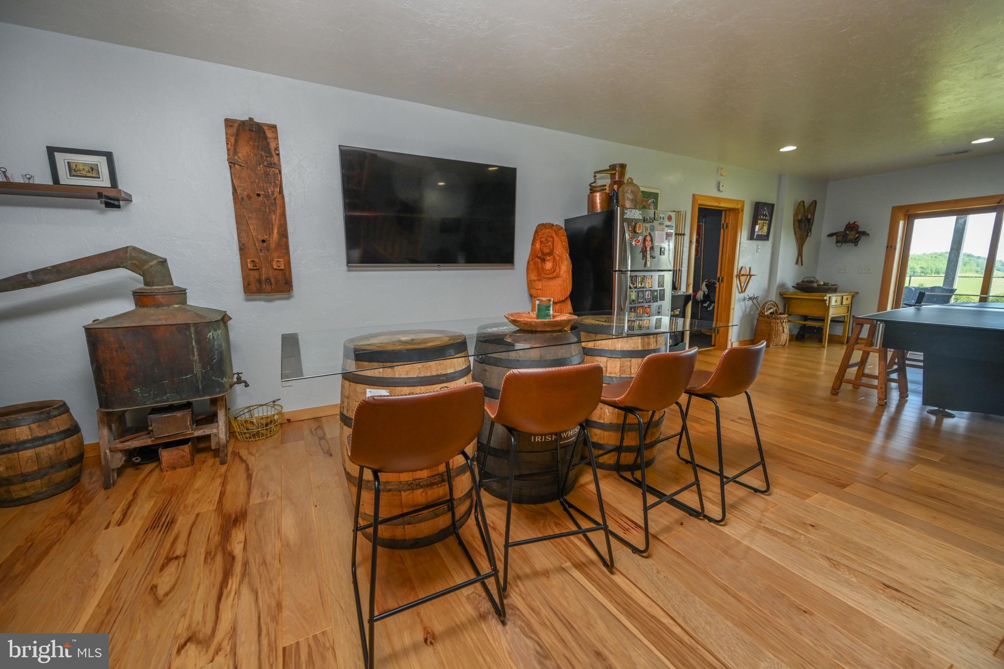 2325 Accident Friendsville Road Accident, MD 21520 - Photo 58 of 107 a view of a dining room with furniture and wooden floor