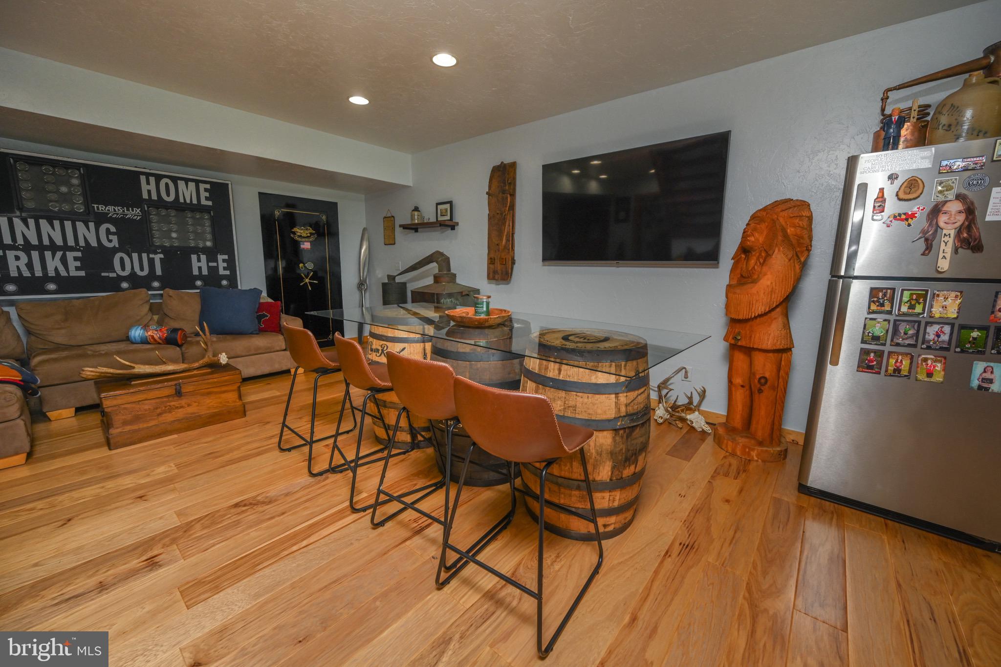 2325 Accident Friendsville Road Accident, MD 21520 - Photo 60 of 107 a living room with furniture a flat screen tv and floor to ceiling window