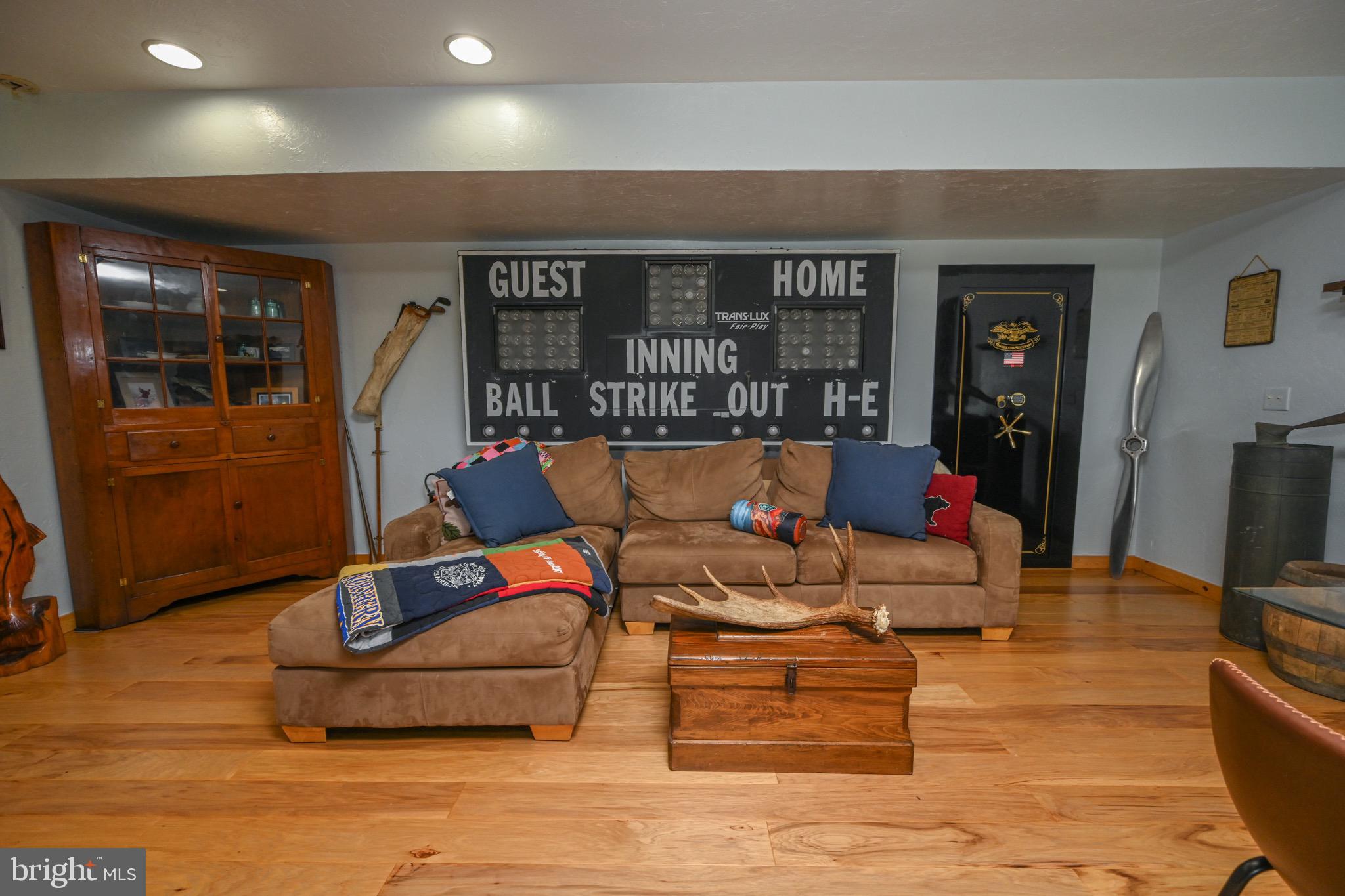 2325 Accident Friendsville Road Accident, MD 21520 - Photo 60 of 107 a living room with furniture a flat screen tv and a table